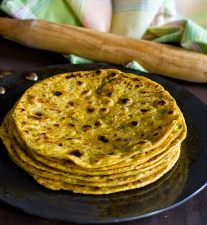 methi thepla,an Indian flatbread stacked and served with buttermilk and pickles