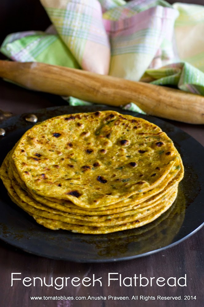 methi thepla,an Indian flatbread stacked and served with buttermilk and pickles