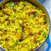 vegetable biryani made in the Instant pot and served in a blue cast iron enameled dutch oven