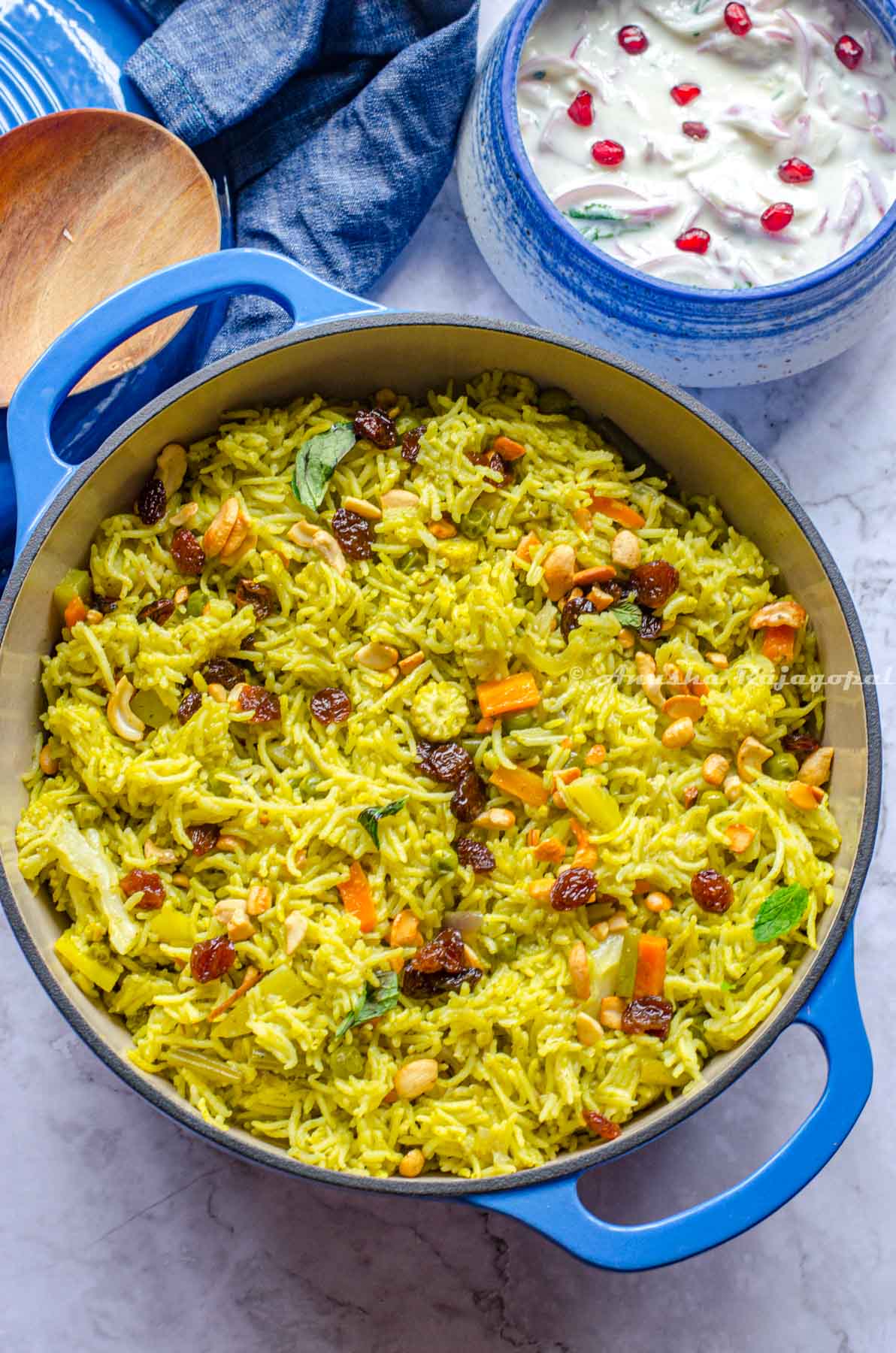 vegetable biryani made in the Instant pot and served in a blue cast iron enameled dutch oven