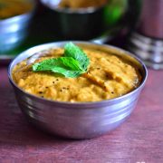 easy south indian onion tomato chutney served in a steel bowl