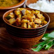 Pan roasted plantains served in a wooden bowl