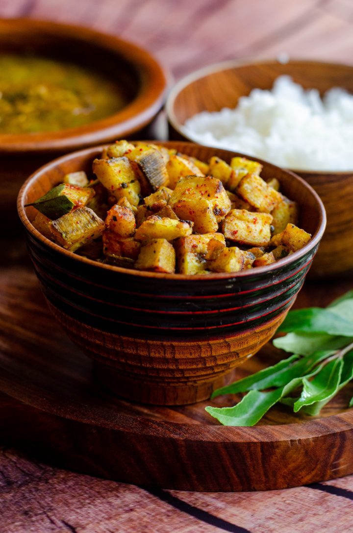 Pan roasted plantains served in a wooden bowl