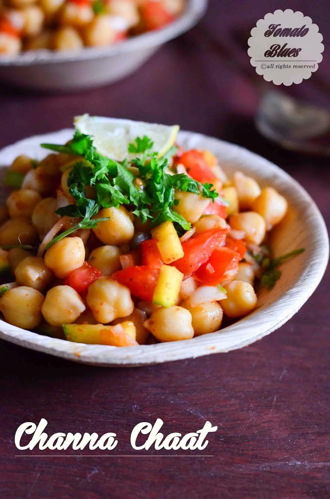 Channa chaat served in a beige bowl with cilantro leaves garnished on top