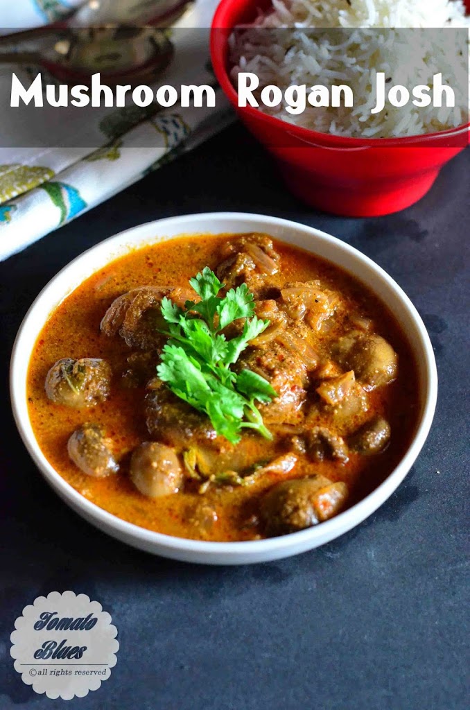 Mushroom Rogan Josh garnished with coriander leaves and served in a white bowl with cumin scented rice