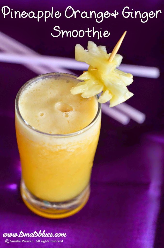 Pineapple Ginger Orange Smoothie Served in a glass on a purple background