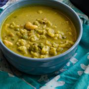 cauliflower cashew curry served in a blue bowl