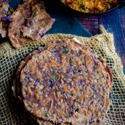 Ragi chapati with purple cabbage stacked and served with baingan bartha