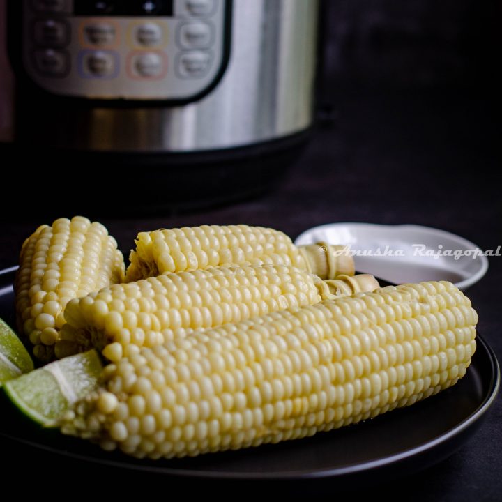 corn on the cob made in the instant pot and served on a black plate