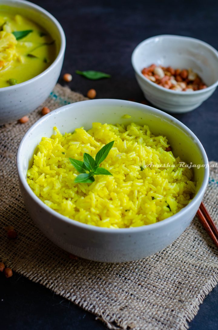 turmeric basil fried rice served in a white bowl placed on a burlap mat