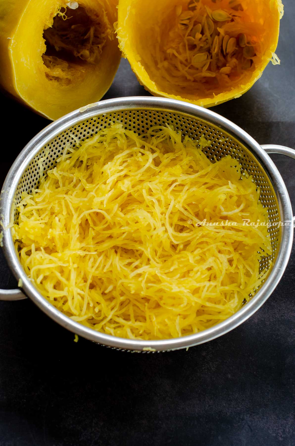 Spaghetti squash cooked in the instant pot drained in a colander