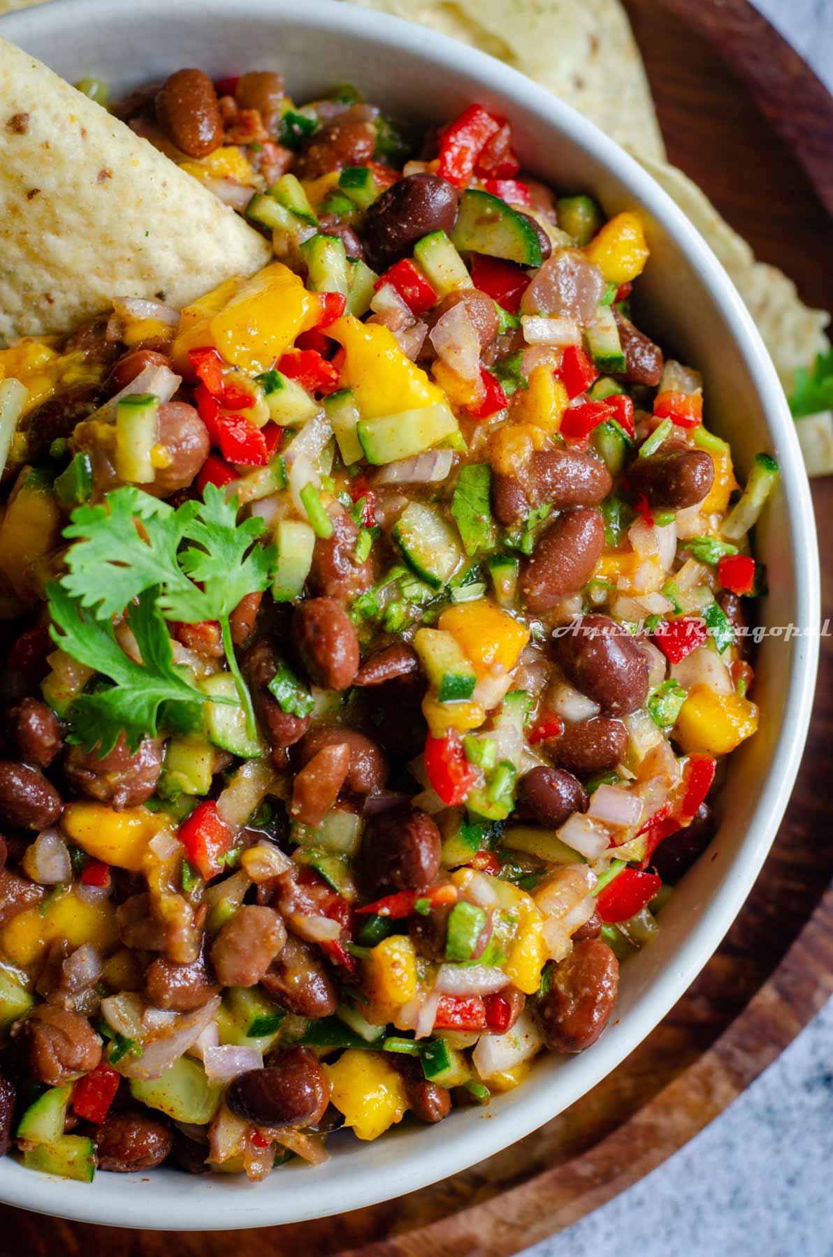 a close up shot of vegan black bean and mango salad