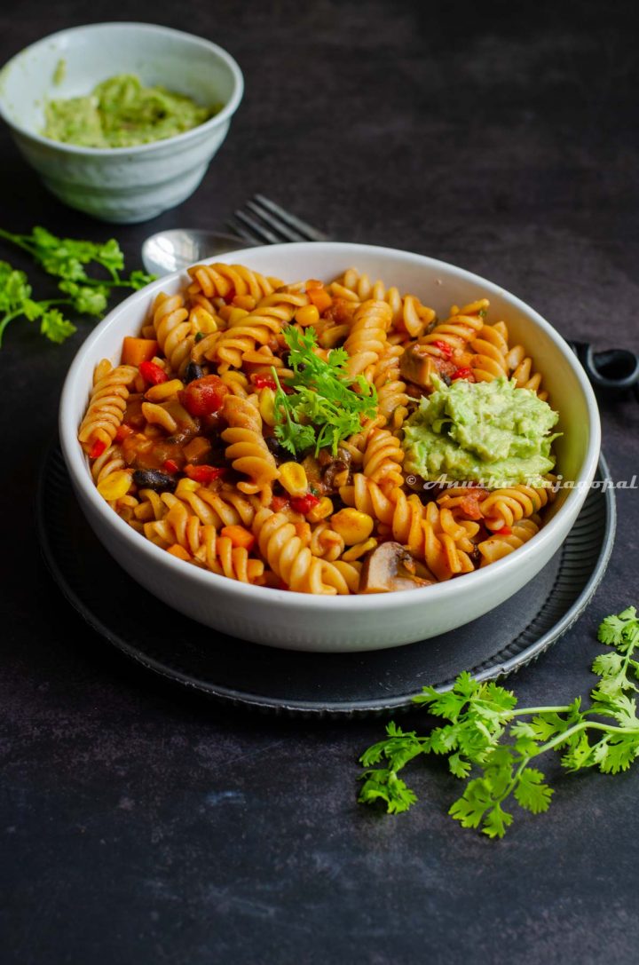 taco-pasta-with-beans-and-vegetables-served-in-a-white-bowl