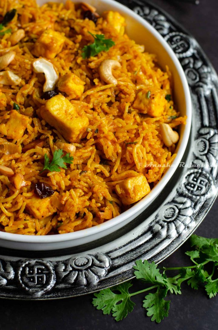some-one-pot-paneer-biryani-served-in-a-shallow-white-plate 