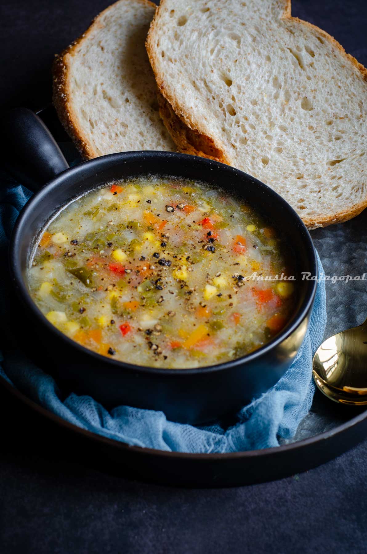 delicious vegan vegetable soup served with sliced bread