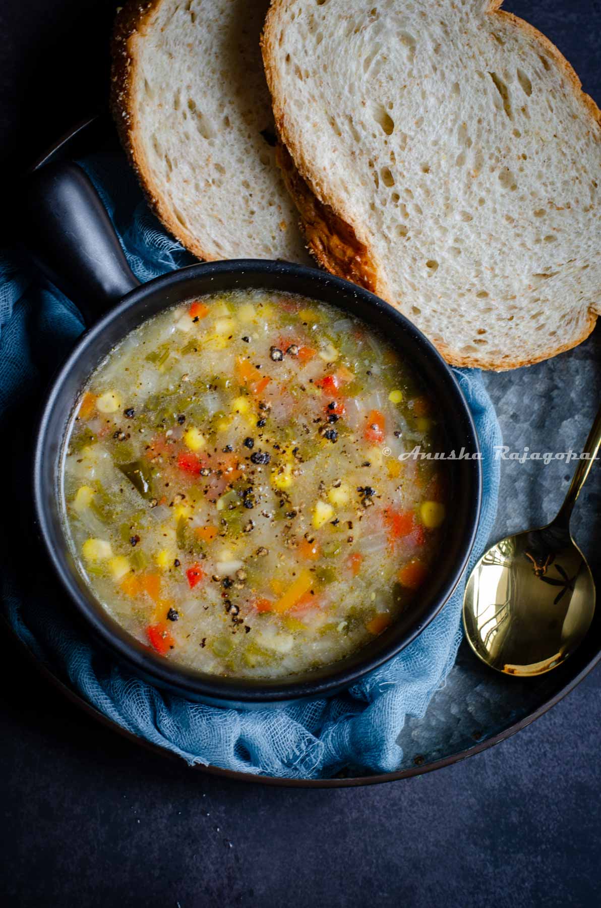 A bowl of Instant Pot vegetable soup and some bread