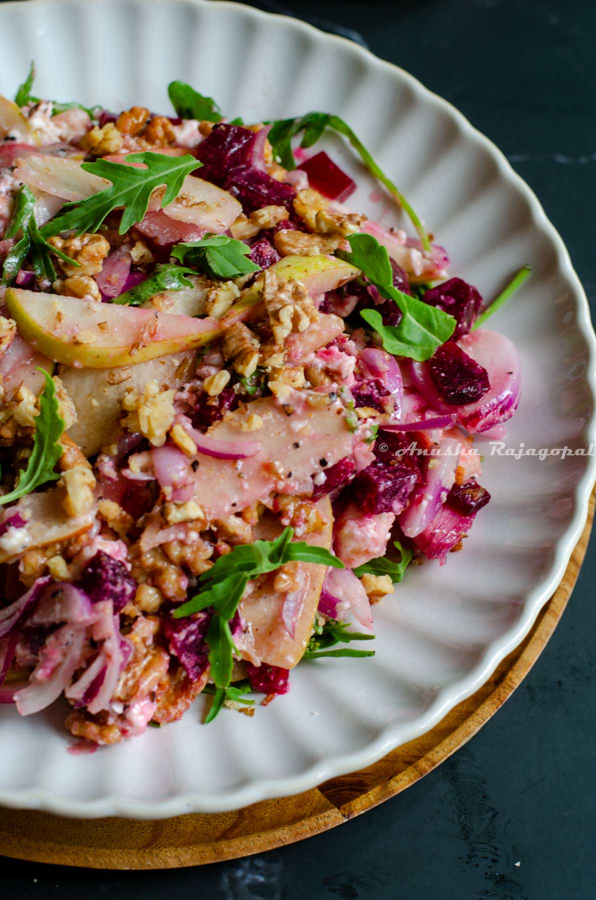 colorful and healthy beetroot salad with feta and walnuts