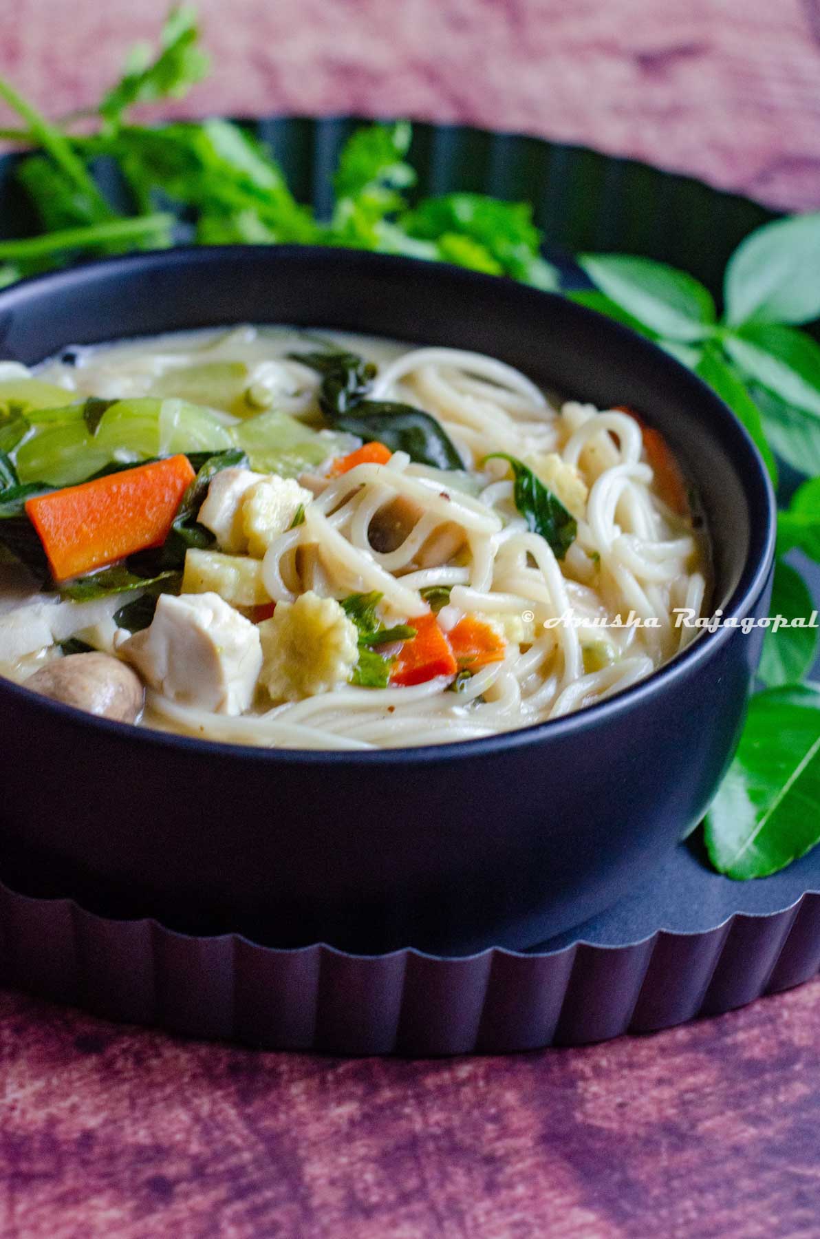 A bowl of delicious Thai coconut noodle soup