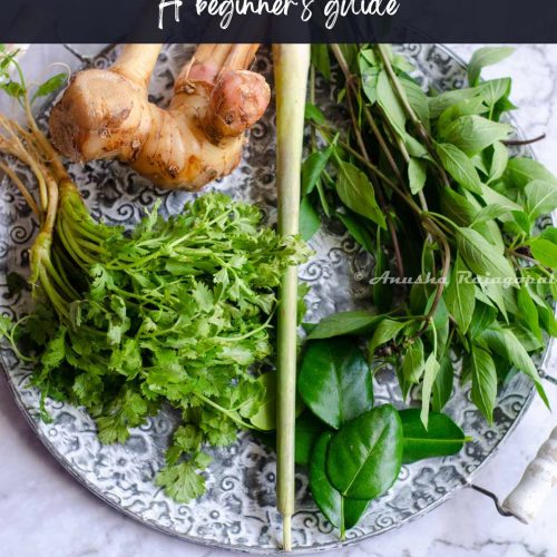 A platter featuring essential Thai herbs including galangal and lemongrass