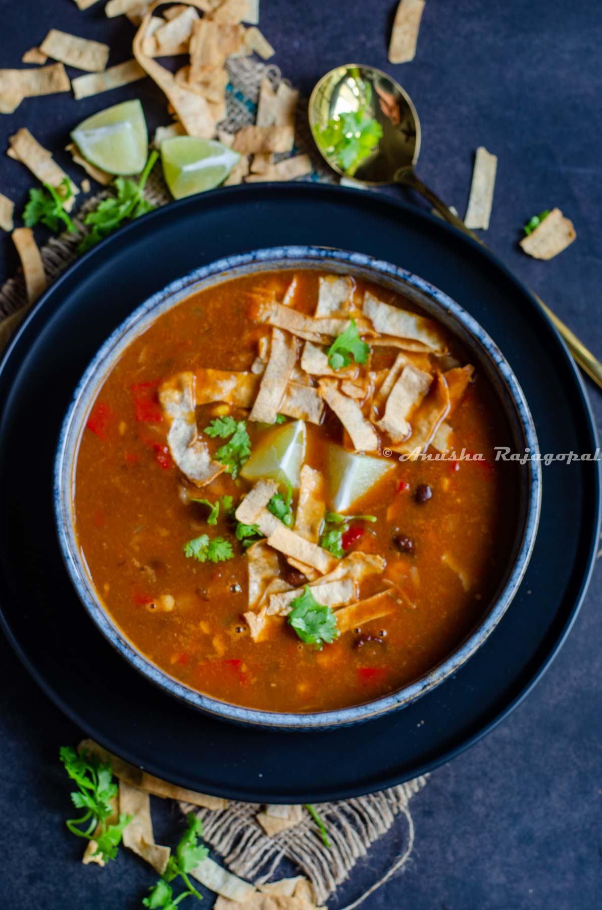 Delicious tortilla soup with air fried tortilla strips and lime