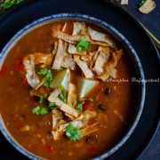 a bowl of vegan tortilla soup with black beans